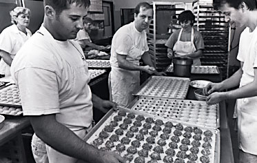 Putting the finishing accents on our various amaretti cookies.